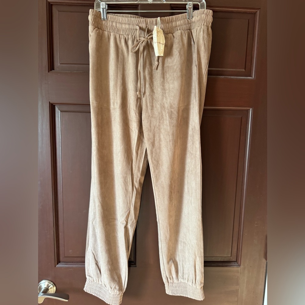 Tan velour pants NWT.